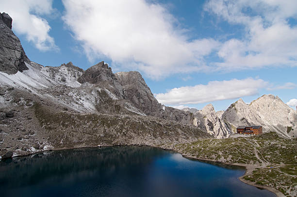 Karlsbader Hütte and Laserzsee Alpine Hut behind the nice blue Laserz-Lake karlsbader hütte stock pictures, royalty-free photos & images