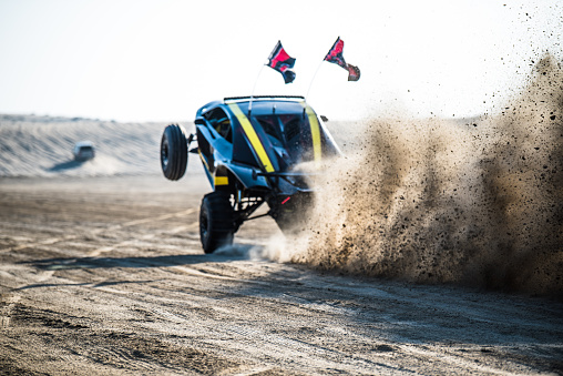 Doha, Qatar, February 23, 2018: Off road buggy car on the sand dunes of the Qatari desert.