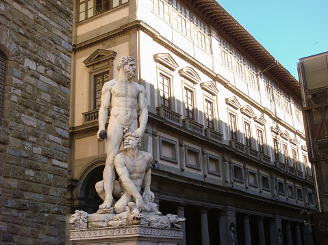 Bologna, Italy - April 05 2019: The Fountain of Neptune (Italian: Fontana di Nettuno) is a monumental civic fountain located in the eponymous square, Piazza del Nettuno, next to Piazza Maggiore.