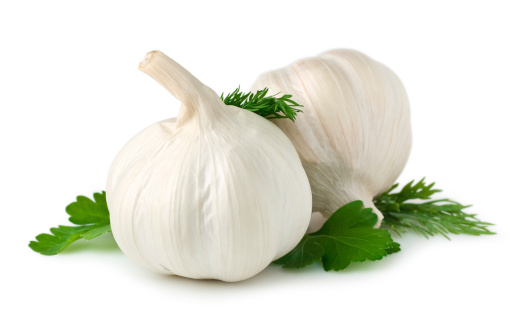 Garlic cloves on white. This file includes