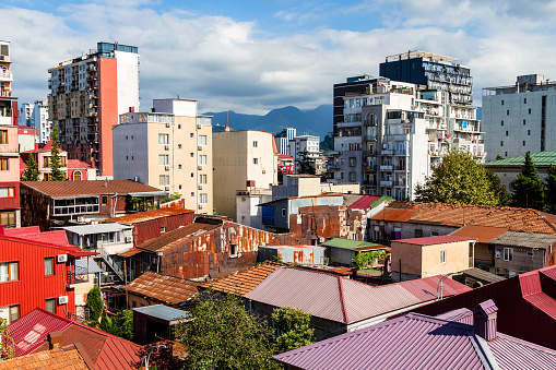travel to Georgia - view of one-storey and multy-storey houses in residential district in Batumi city on sunny autumn day