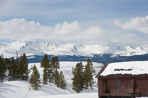 Old Mine Building in Winter "An old outbuilding at Robert Emmet mine, overlooking the mining district of Leadville, Colorado and the Continental Divide. It was here that union miners and mine owners came to blows over a strike in 1896. At least four miners and one fireman were killed during the riots that ensued. In the background is Mount Massiave, a 14,000 foot peak in the Sawatch Mountain Range of the Rocky Mountains." leadville stock pictures, royalty-free photos & images