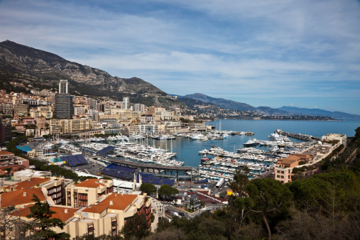 Monaco - April 19, 2022: Overview with the Monaco city and port during a spring sunny day with the F1 circuit construction under way.