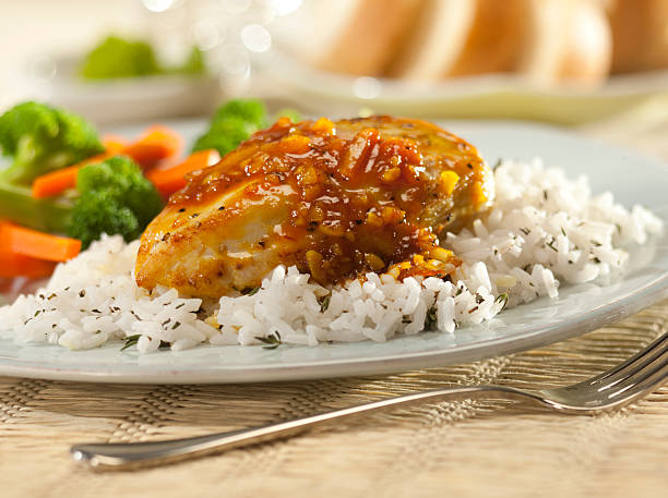 istock Orange glazed chicken breast with rice. 182695289
