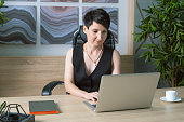 Portrait of a business woman with short hair in an office office