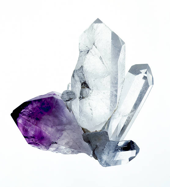 Amythyst & Quartz crystals A group of amythyst and quartz crystals isolated on a white background. Originaly shot 5x4 film stock. stone object photos stock pictures, royalty-free photos & images