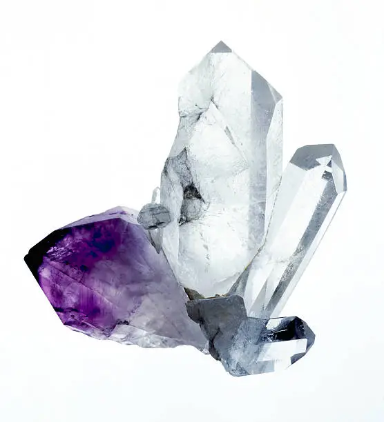 A group of amythyst and quartz crystals isolated on a white background. Originaly shot 5x4 film stock.