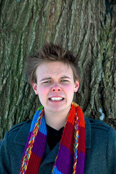 istock Young man shows feelings: angrily clenching his teeth 182695976