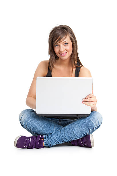 istock young attractive woman with laptop 182696311