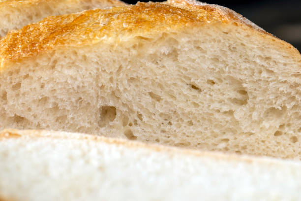 istock wheat loaf of bread close-up on the table 1826966428