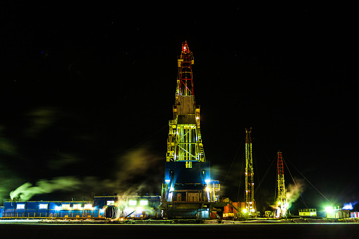 photo of drilling rig in oil field for drilled into subsurface
