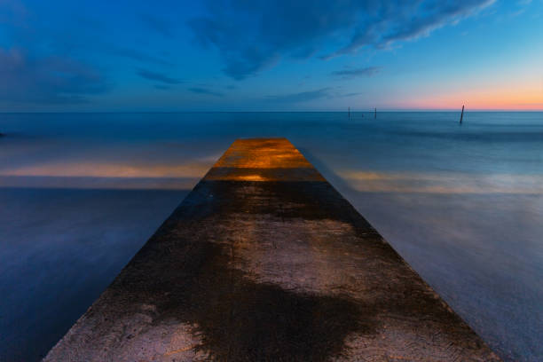 istock View of the pier at sunset time 1826967976
