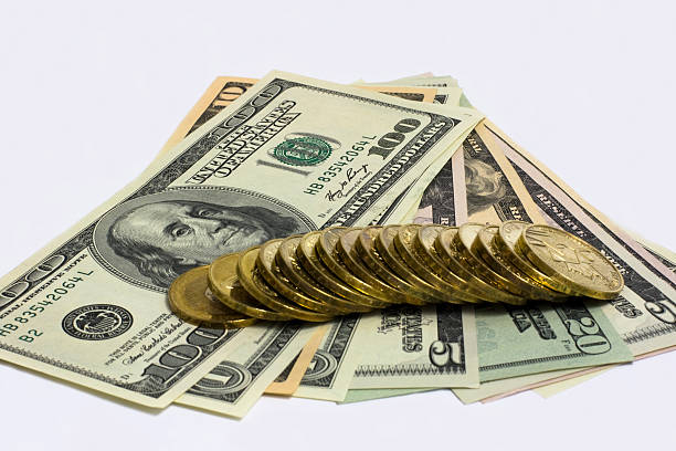 ゴールドのコインとドル紙幣 - number 10 gold business paper currency ストックフォトと画像