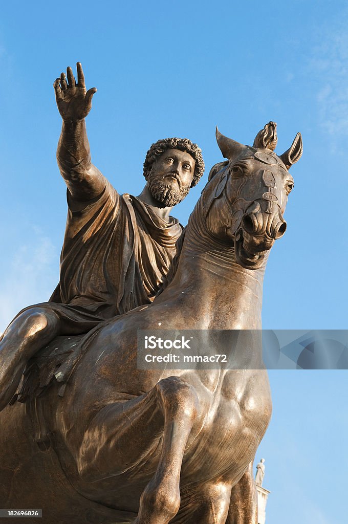 Equestrian Statue of Marcus Aurelius "The Equestrian Statue of Marcus Aurelius in Rome, Italy, is made of bronze and stands 11aa 6aA tall. Although the emperor is mounted, it exhibits many similarities to standing statues of Augustus. The original is on display in the Palazzo dei Conservatori, with the one now standing in the open air of the Piazza del Campidoglio being a replica made in 1981 when the original was taken down for restoration in the Palazzo." Marcus Aurelius Stock Photo