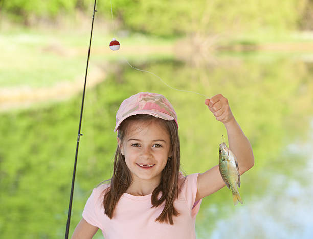 istock Little Girl with Fish She Caught 182696875