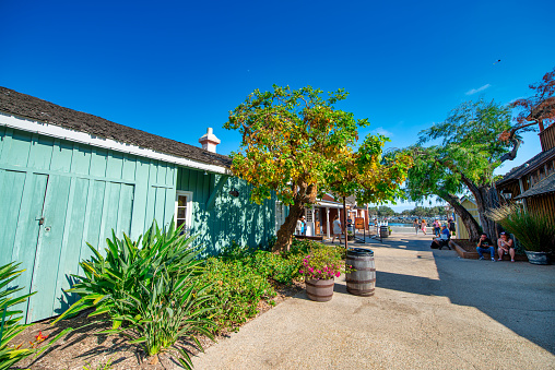 Tourists, streets and buildings along Seaport Village and Embarcadero Park