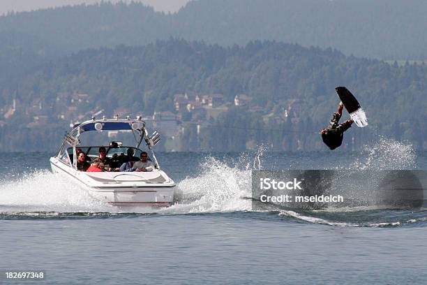 A Wakeboarder In The Water Being Pulled By A Boat Stock Photo - Download Image Now - Nautical Vessel, Wakeboarding, Aquatic Sport