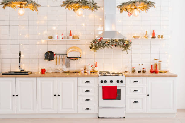 istock Interior of a light white kitchen with bright red decor elements in the Scandinavian style, decorated for Christmas 1826976482