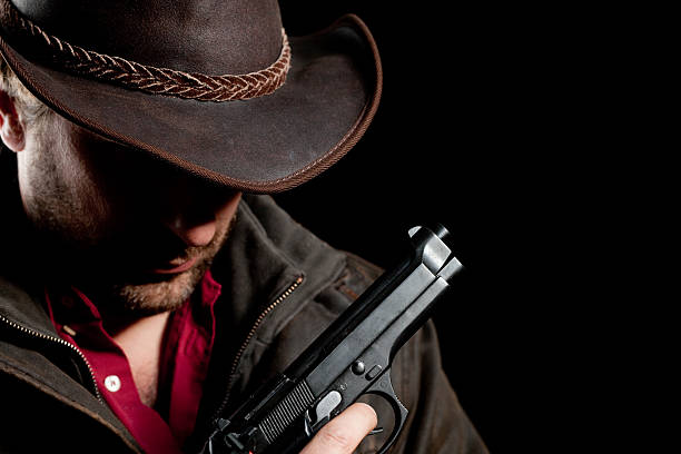 istock Man in leather with a gun 182697868