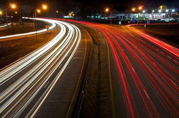 istock Blurred Motion of Car Lights on Highway at Night 182698120