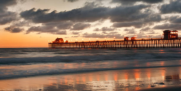 istock Dramatic Clouds Sunset Pacific Ocean Beach and Pier, Oceanside, California 182698202