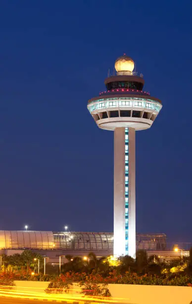 "Singapore Changi Airport Control Tower in the evening. The airport is one of the top ten in the world, ranked by travelers."