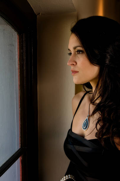 istock Girl looking out window 182698934