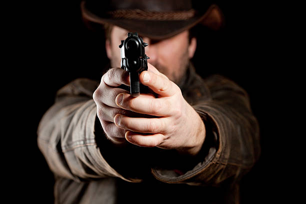 istock Man aiming a gun at you 182698980
