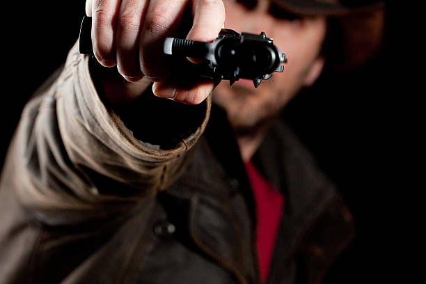 istock Man aiming a gun at you 182698984