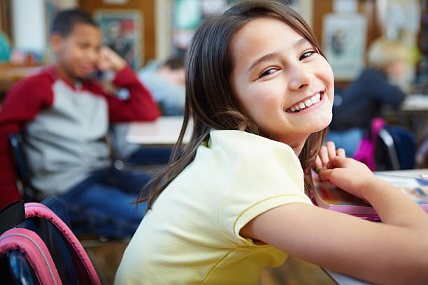 istock Adorable Little girl at elementary school , classroom view 182699052