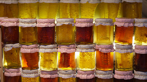 istock Jars of honeycomb suspended in honey 182699310