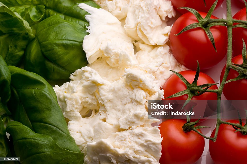 Close-up of three different kinds of vegetables the ingredients of the famous dish tricolore salad aligned in the pattern of the Italian flag, the flag from which the salad takes its name. Italy Stock Photo