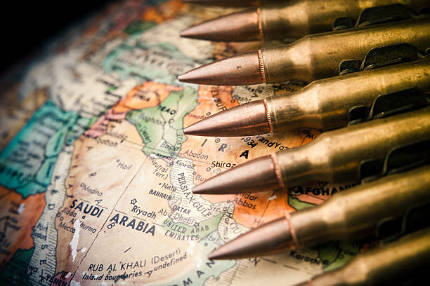 Middle East Conflict Map of the Middle East with Saudi Arabia in focus with bullets draped across arabian sea photos stock pictures, royalty-free photos & images