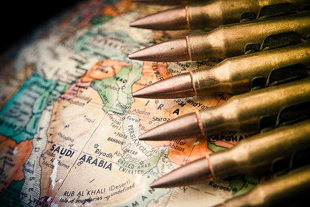 Middle East Conflict Map of the Middle East with Saudi Arabia in focus with bullets draped across middle east stock pictures, royalty-free photos & images