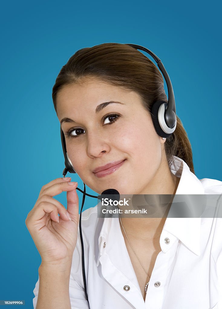 Operator Attractive business woman with headphones.Please see some similar pictures: Blue Background Stock Photo