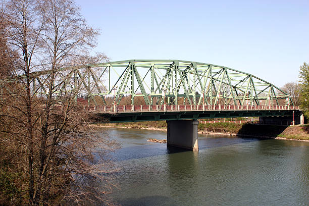 Ferry Street Bridge in Eugene Oregon "Photo of Ferry Street Bridge in Eugene, Oregon, which connects Coburg Road with downtown Eugene and the University of Oregon." eugene oregon stock pictures, royalty-free photos & images
