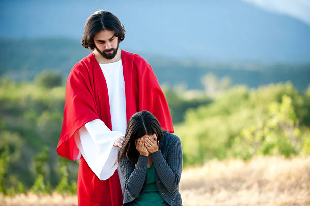 Jesus helping a woman and giving comfort to her