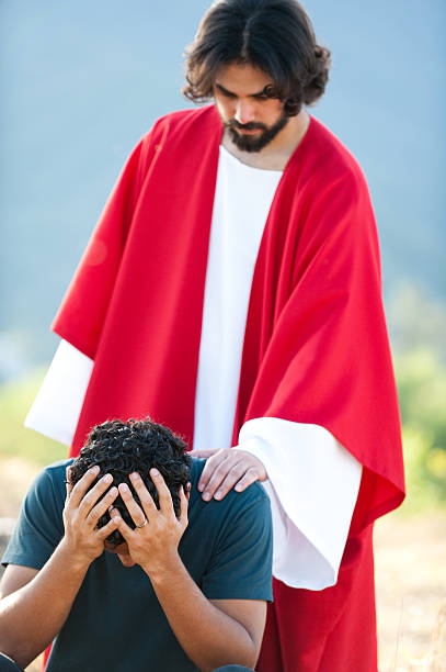 istock Jesus comforting a young man 182700095