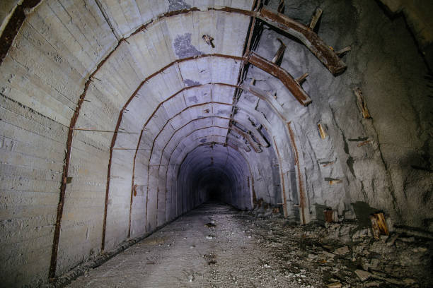 istock Tunnel with concrete walls in old abandoned Soviet bunker 1827001966