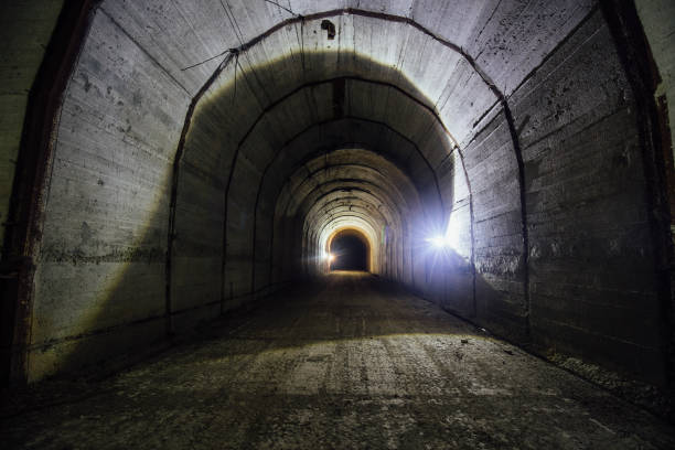istock Tunnel with concrete walls in old abandoned Soviet bunker 1827003838