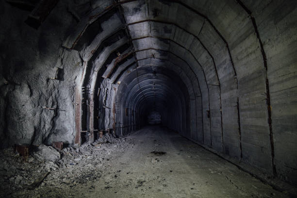 istock Tunnel with concrete walls in old abandoned Soviet bunker 1827004898