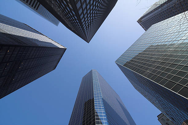 istock Low angle shot of corporate buildings against blue sky 182700562