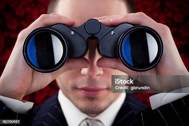 Man Looking Through Binoculars Stock Photo - Download Image Now - 20-24 Years, Adult, Adults Only
