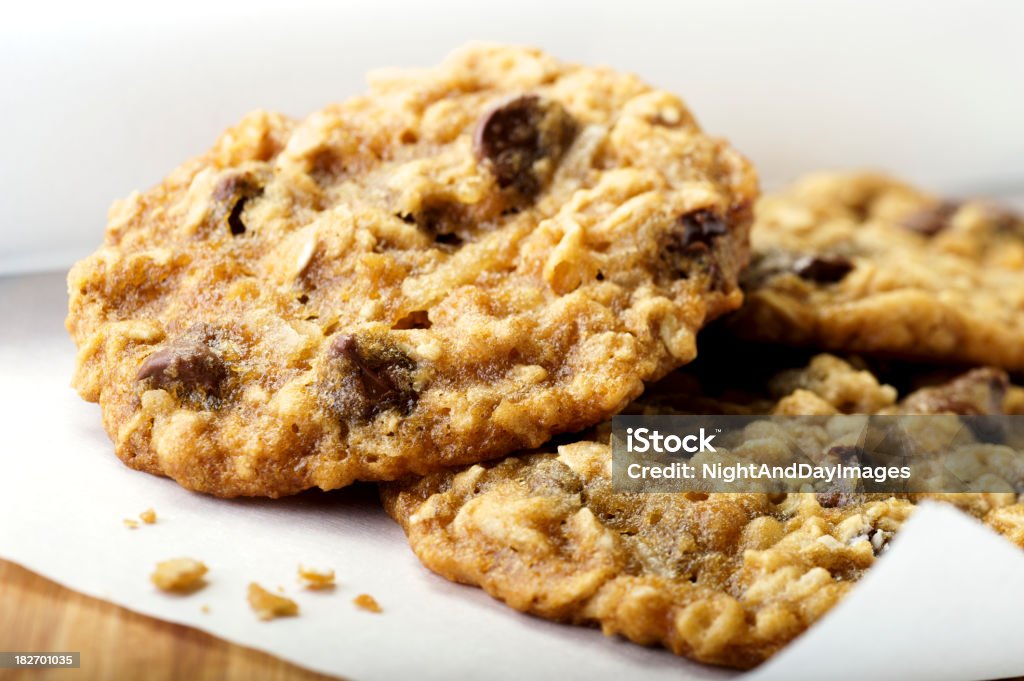 Oatmeal Chocolate Chip Cookies SEVERAL MORE IN THIS SERIES. Stack of warm homemade oatmeal chocolate chip cookies.  Very shallow DOF. Chocolate Chip Cookie Stock Photo