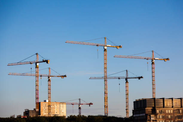 istock Construction of a new house with scaffolding and cranes 1827010375