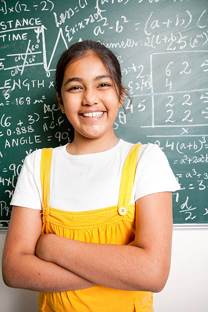 istock Cheerful Indian Girl Student with Mathematics Problems 182701103