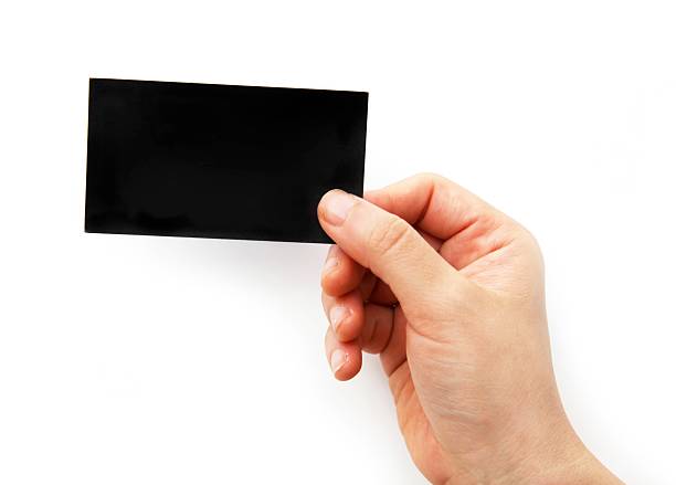 istock Empty Black business card in a hand 182701223