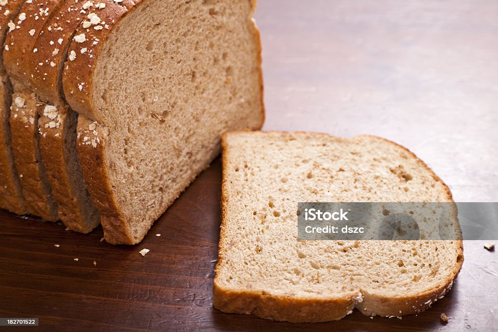 sliced loaf of multi-grain oat bread sliced loaf of multi-grain oat bread.Check out our other food shots Bread Stock Photo