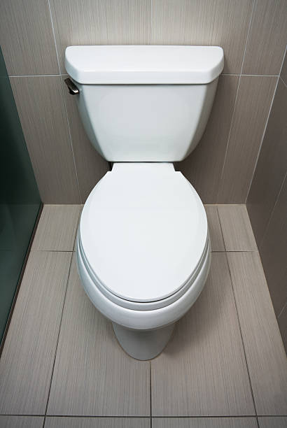 closed toilet in a hotel room stock photo