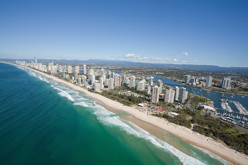 Aerial photo of the Gold Coast in Queensland Australia. All the skyscrapers and beautiful beaches are gleaming in the morning light.